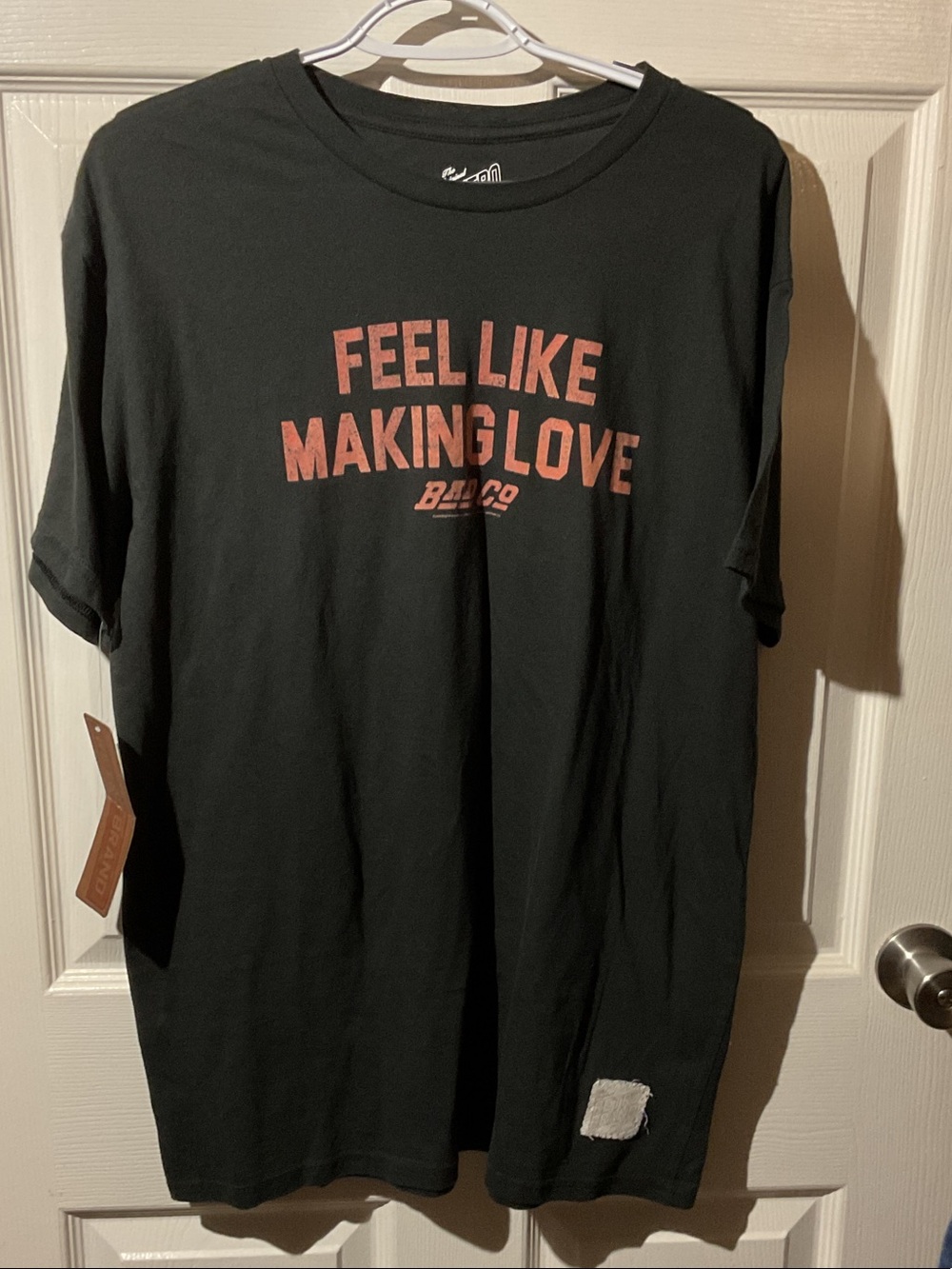 Bad Company Original Retro Brand Black Tee with Coral Text Graphic